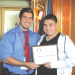 Anselmo Garza Jr. of the Port Isabel Rotary Club recognizes Juan C. Romero as Student of the Month.